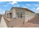 Relaxing outdoor patio featuring a privacy wall, paved floors and comfortable seating at 333 Aravalli Crest St, Henderson, NV 89015