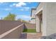 Private patio with seating, turf, and a stylish privacy wall for outdoor enjoyment at 333 Aravalli Crest St, Henderson, NV 89015