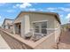 Private patio with seating, a privacy wall, and desert landscaping for outdoor relaxation at 333 Aravalli Crest St, Henderson, NV 89015