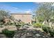 Inviting backyard with mature landscaping, a picnic table, and walking trail at 3457 Abilene Gold Ct, Las Vegas, NV 89129