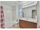 Bright bathroom featuring a shower-tub combo with a floral curtain and single sink vanity at 3457 Abilene Gold Ct, Las Vegas, NV 89129