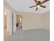 Bedroom with ceiling fan and bathroom access through open doorway at 3457 Abilene Gold Ct, Las Vegas, NV 89129