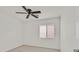 Bedroom with natural light from a window, neutral walls and ceiling fan at 3457 Abilene Gold Ct, Las Vegas, NV 89129