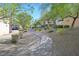 Scenic view of a tree-lined pathway through a beautifully landscaped community at 3457 Abilene Gold Ct, Las Vegas, NV 89129