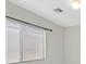 Natural light filters through window with blinds in this neutral interior space at 3457 Abilene Gold Ct, Las Vegas, NV 89129
