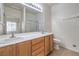 Bathroom featuring double sinks, ample counter space, and a large mirror at 3520 Kittiwake Rd, North Las Vegas, NV 89084