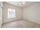 Bedroom with neutral carpet and view to the exterior at 3520 Kittiwake Rd, North Las Vegas, NV 89084