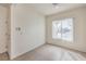 Entryway with tile flooring, window with blinds, and a security system panel at 3520 Kittiwake Rd, North Las Vegas, NV 89084