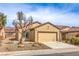 Charming single-story home featuring desert landscaping, a two-car garage, and a neutral color scheme at 3520 Kittiwake Rd, North Las Vegas, NV 89084