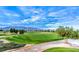 Scenic golf course view featuring lush green fairways and mountain backdrop at 3520 Kittiwake Rd, North Las Vegas, NV 89084