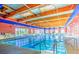 Bright indoor pool with a high wood ceiling and ample natural light at 3520 Kittiwake Rd, North Las Vegas, NV 89084