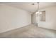 Spacious living area showcases neutral carpet and a glimpse into the hallway at 3520 Kittiwake Rd, North Las Vegas, NV 89084