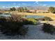 Community pond on a golf course with homes and mountains in the background at 3520 Kittiwake Rd, North Las Vegas, NV 89084