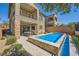 This private backyard features a refreshing pool, a covered patio, and an outdoor dining area at 39 Strada Fontana, Henderson, NV 89011