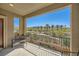 Enjoy the view from this balcony overlooking the desert landscape with a wrought iron railing and partial seating at 39 Strada Fontana, Henderson, NV 89011