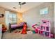 bedroom featuring a playful design, a large window, and ample space for toys and activities at 39 Strada Fontana, Henderson, NV 89011