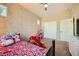 A playful bedroom design with patterned wallpaper and fun decor for a  at 39 Strada Fontana, Henderson, NV 89011