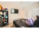 Comfortable bedroom features a ceiling fan, closet, mounted TV, and neutral decor at 39 Strada Fontana, Henderson, NV 89011