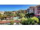 Resort-style community pool area with lush landscaping and multiple seating areas for relaxation at 39 Strada Fontana, Henderson, NV 89011