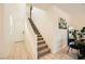 Bright entryway with tile floors, carpeted stairs, and a view of the upper floor at 39 Strada Fontana, Henderson, NV 89011