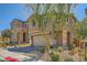 Beautiful two-story home features a two-car garage, easy-to-care-for landscaping, and a stone pillar entry at 39 Strada Fontana, Henderson, NV 89011