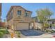 Charming two-story home with neat landscaping, and patterned pavers leading to the two-car garage at 39 Strada Fontana, Henderson, NV 89011