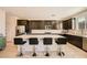 Sleek kitchen with a large island, stainless steel appliances and plenty of countertop space at 39 Strada Fontana, Henderson, NV 89011