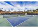 Outdoor pickleball courts with mountain views, offering a fun and active community lifestyle at 39 Strada Fontana, Henderson, NV 89011