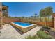 Backyard with a modern rectangular pool and desert landscaping at 39 Strada Fontana, Henderson, NV 89011
