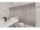 Bathroom featuring a shower with curtain, single sink vanity, and mirror at 3915 Palm Beach St # 201, Las Vegas, NV 89129