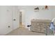 Comfortable Bedroom with a changing table, closet, and view into laundry area at 3915 Palm Beach St # 201, Las Vegas, NV 89129