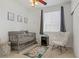 Lovely Bedroom with a gray crib, rocking chair, and a window with gray curtains at 3915 Palm Beach St # 201, Las Vegas, NV 89129