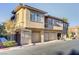 Well-kept condo building features garages and tidy landscaping at 3915 Palm Beach St # 201, Las Vegas, NV 89129