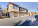 Attractive condo building with multiple garages and manicured landscaping at 3915 Palm Beach St # 201, Las Vegas, NV 89129