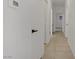 Hallway with tiled floors, multiple doors, thermostat on wall, and access to other rooms at 3915 Palm Beach St # 201, Las Vegas, NV 89129