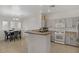 Bright kitchen with modern appliances, a breakfast bar, and an adjacent dining area at 3915 Palm Beach St # 201, Las Vegas, NV 89129