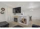 Open living area with a fireplace and entertainment center, adjacent to the dining space at 3915 Palm Beach St # 201, Las Vegas, NV 89129