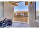 This patio features textured stucco, a metal railing, and a view of the neighborhood at 3915 Palm Beach St # 201, Las Vegas, NV 89129