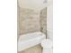 Bathroom featuring a tiled shower over tub and white toilet at 4131 Gannet Cir # 389, Las Vegas, NV 89103