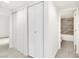 Hallway with white doors leading to the bathroom and closet at 4131 Gannet Cir # 389, Las Vegas, NV 89103