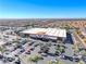 Expansive aerial view showcases a WinCo Foods with a full parking lot in a large neighborhood at 4921 Lazy Day Ct, Las Vegas, NV 89131