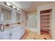 Bright bathroom features a double sink vanity and glass shower at 4921 Lazy Day Ct, Las Vegas, NV 89131