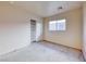 Cozy bedroom with carpet, neutral walls, window and closet at 4921 Lazy Day Ct, Las Vegas, NV 89131