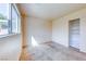 Neutral bedroom with carpet floors, closet, and a window at 4921 Lazy Day Ct, Las Vegas, NV 89131