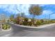 A beautiful community entrance that is well landscaped with mature trees in the park like setting at 4921 Lazy Day Ct, Las Vegas, NV 89131