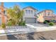 Charming two-story home with a well-kept front yard, mature trees, and a two-car garage at 4921 Lazy Day Ct, Las Vegas, NV 89131