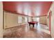 Spacious game room with a pool table, tile floors, and natural light from the windows at 4921 Lazy Day Ct, Las Vegas, NV 89131
