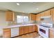 Bright kitchen features stainless steel appliances, wood cabinets, and sink with window at 4921 Lazy Day Ct, Las Vegas, NV 89131