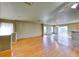 Spacious living room featuring hardwood floors, modern lighting, and sliding glass door at 4921 Lazy Day Ct, Las Vegas, NV 89131