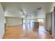 Spacious living room featuring hardwood floors, modern ceiling fan, and neutral paint at 4921 Lazy Day Ct, Las Vegas, NV 89131